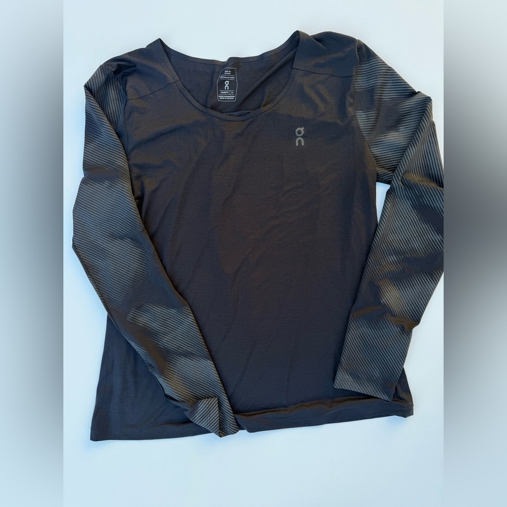 On Running Women’s Black Long-Sleeve Athletic Tee with Subtle Logo